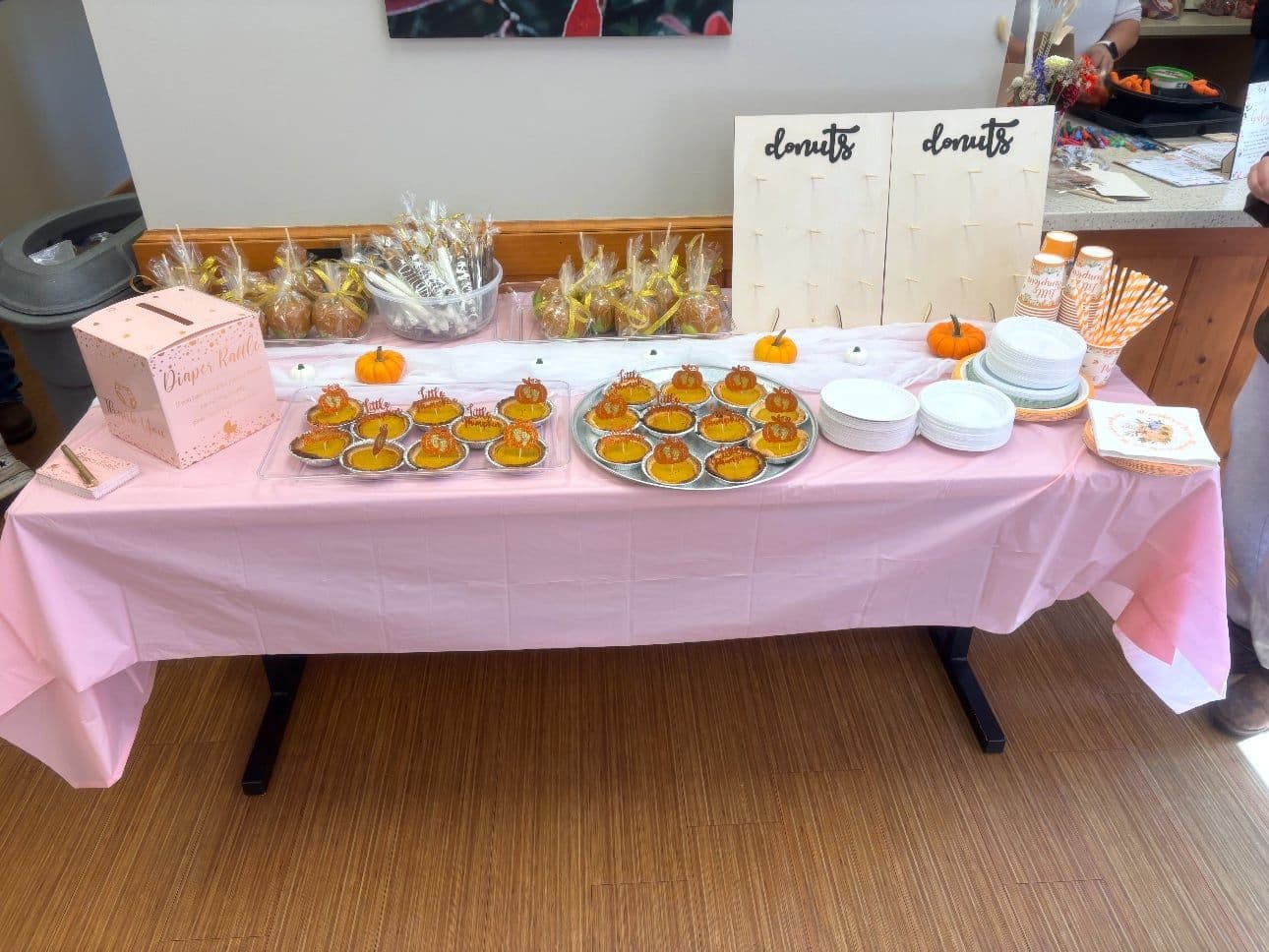 Pink and pumpkin fall dessert table with tarts and caramel apples in Toledo, Ohio